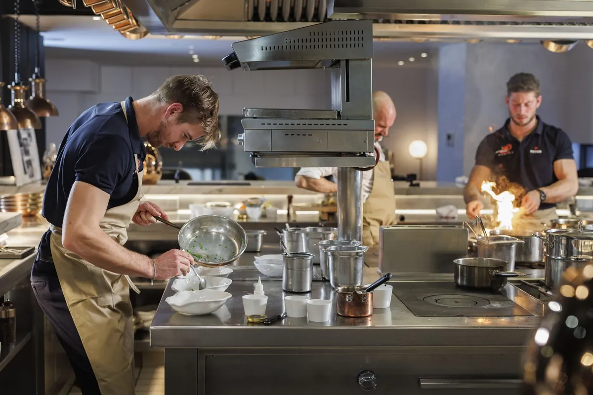 Barnabé Delarze cooking in a professional restaurant kitchen