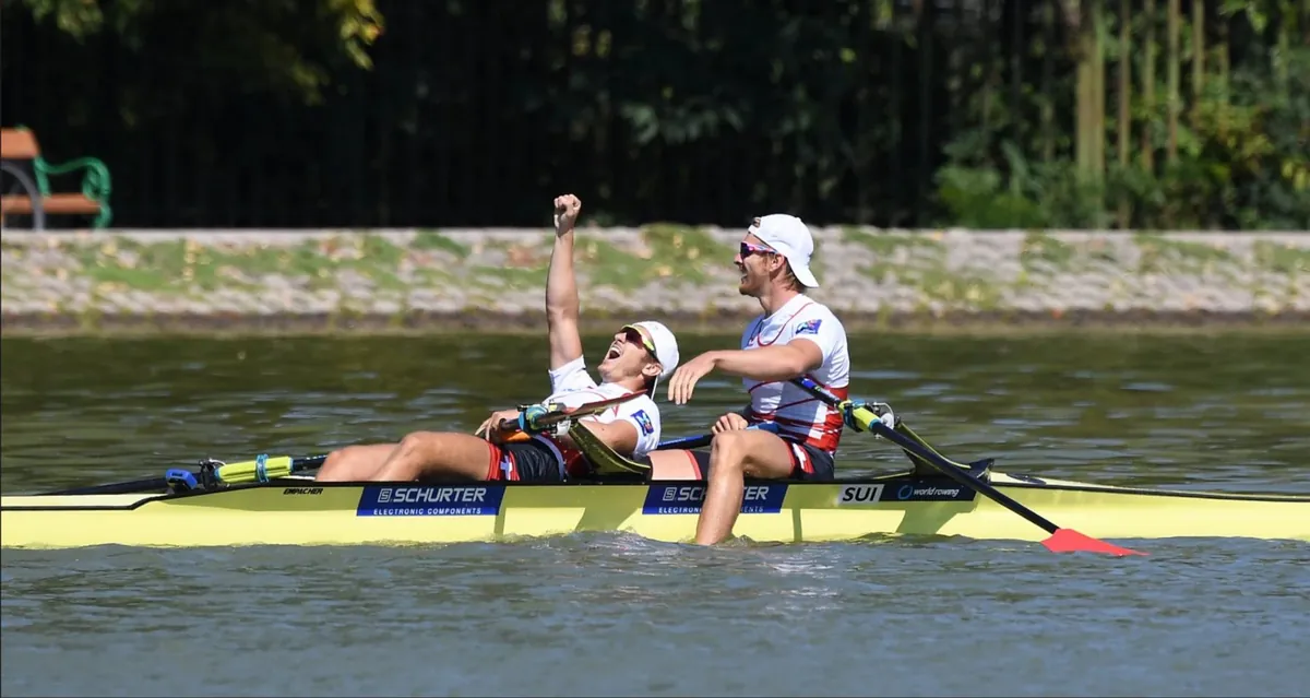 Two Swiss rowers celebrating their silver medal at the 2018 World Championships