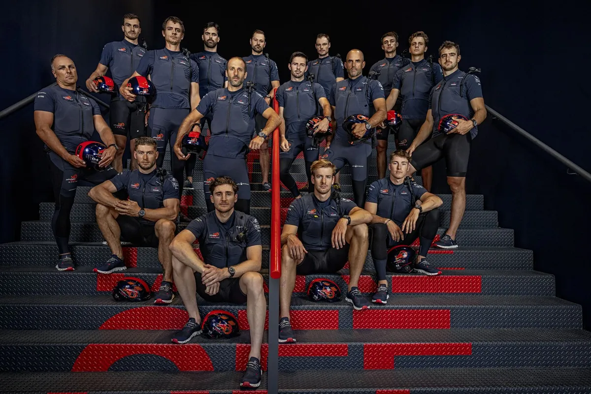 The Alinghi Red Bull Racing sailing team posed on stairs